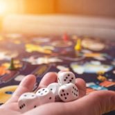 board games concept. Dice, chips and cards on the background of the playing field copy space